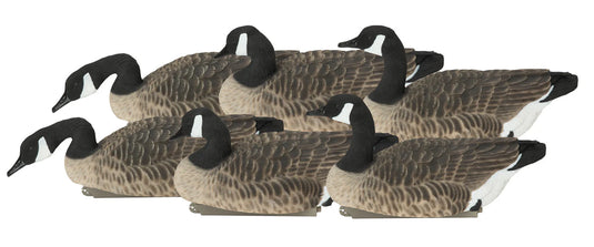 Set of goose decoys on a white background